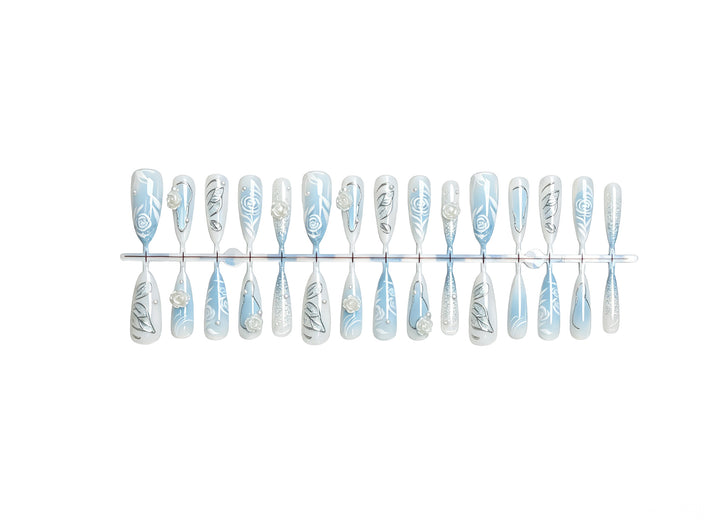 Artificial nail set with elegant floral motifs and glitter effects Stornfield