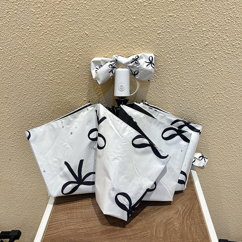 Women's foldable umbrella with elegant bow design Stornfield