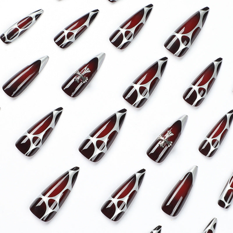 Artful Stiletto Nails with Elegant Cross Decoration Stornfield