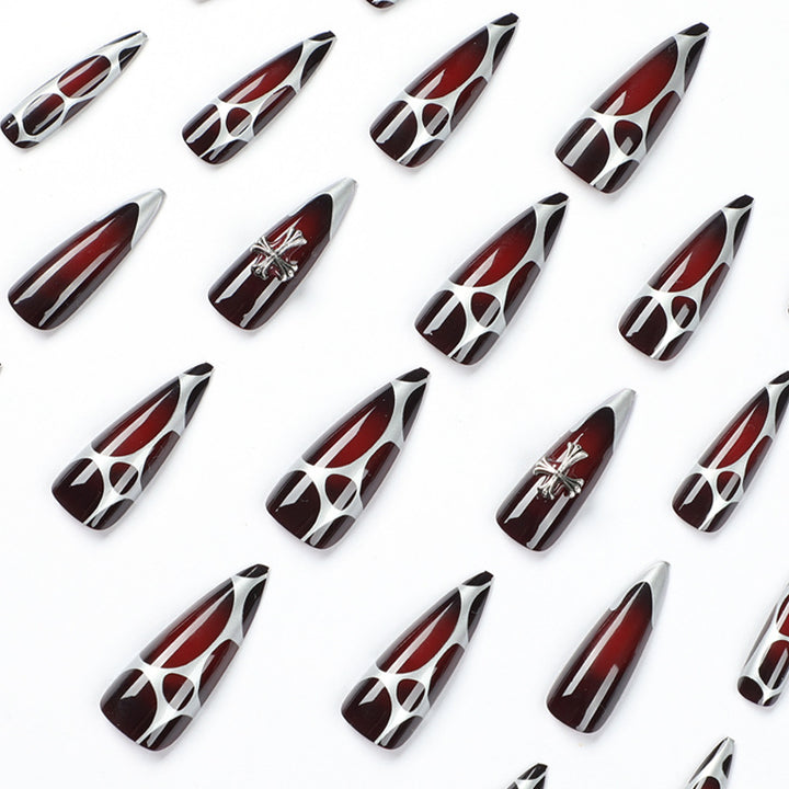 Artful Stiletto Nails with Elegant Cross Decoration Stornfield