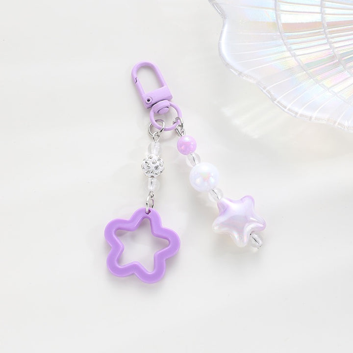 Playful keychain with floral and star motif Stornfield