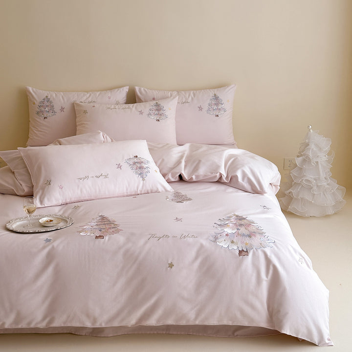 Delicate cotton satin bedding set with pastel embroidered Christmas tree appliqués