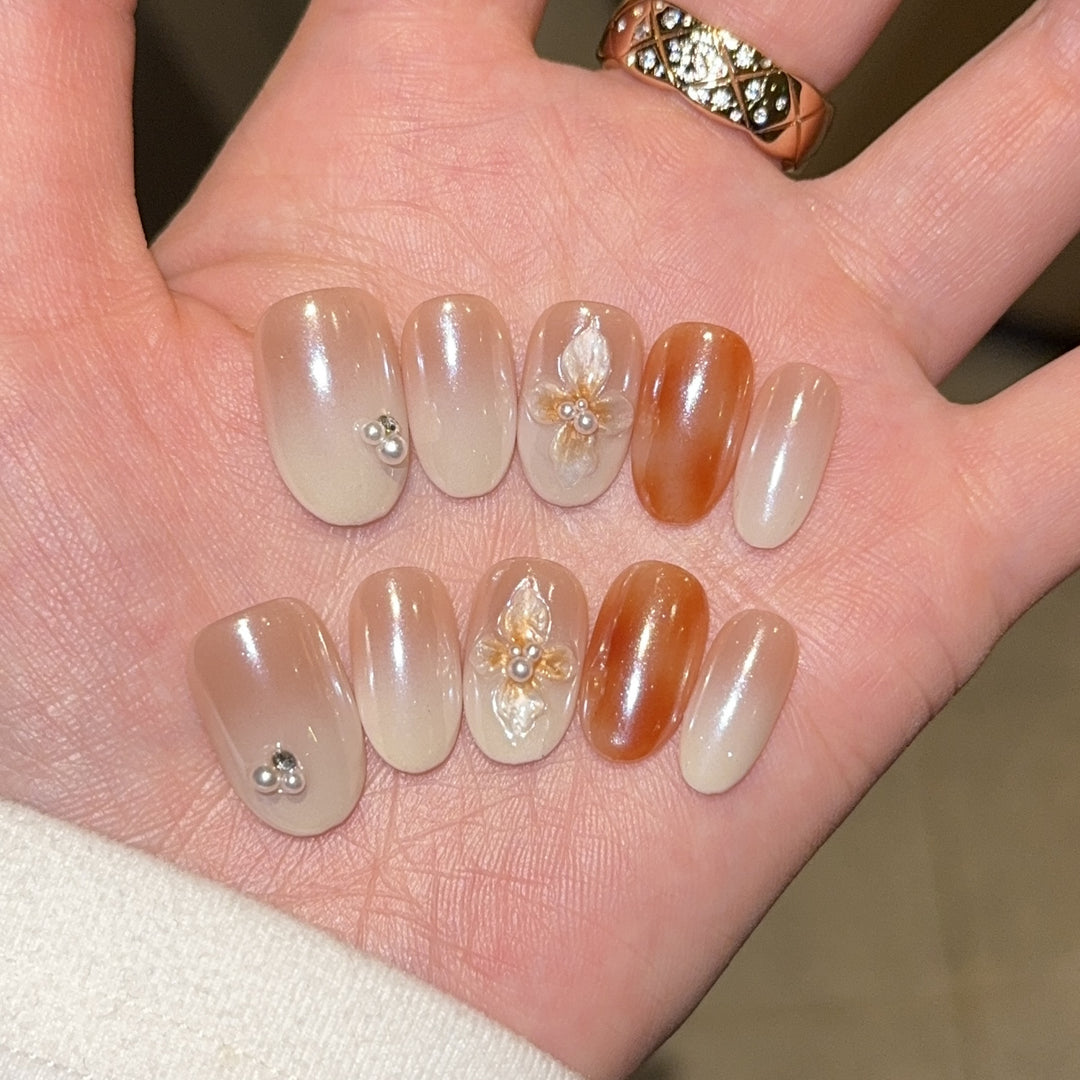 Artificial nails with floral details and glitter coating Stornfield