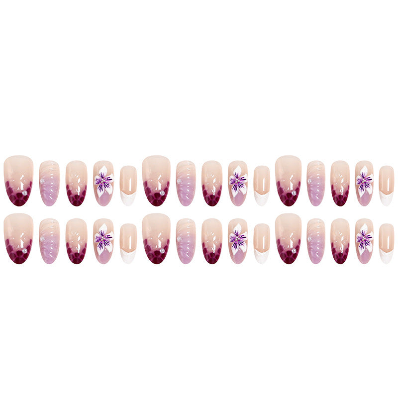 Artificial nails with elegant ombre effects and floral accents Stornfield