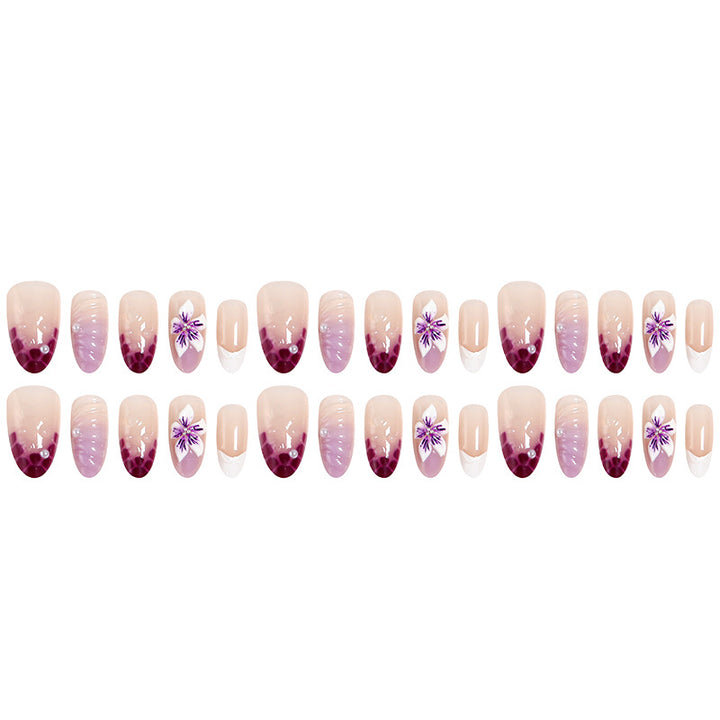 Artificial nails with elegant ombre effects and floral accents Stornfield