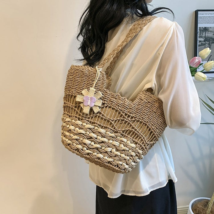Handwoven beach bag with floral accents Stornfield