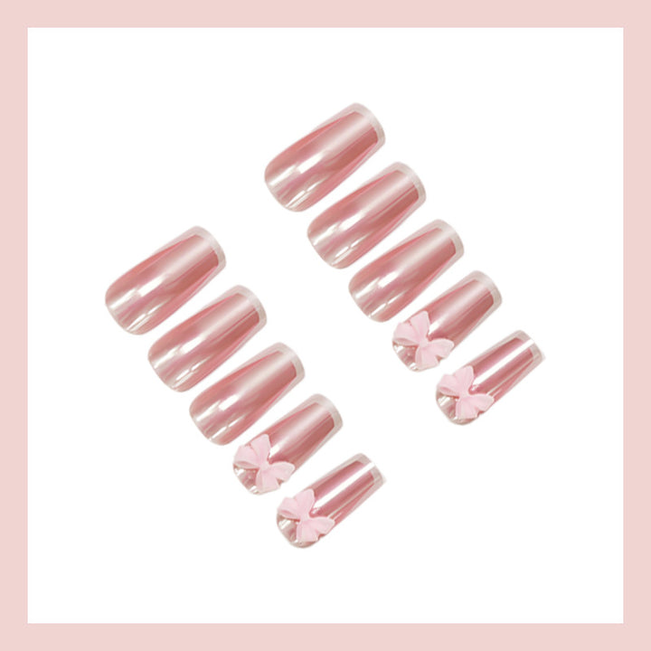 Artificial nail set with stylish bows and elegant French tips Stornfield
