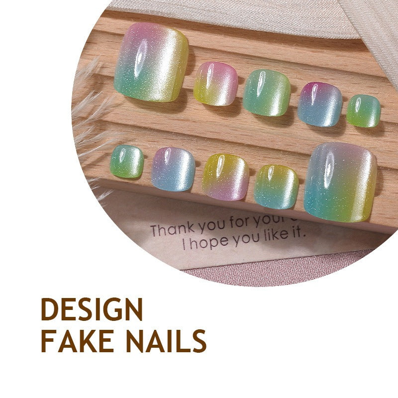 Acrylic nail set with shimmering gradient and elegant designs Stornfield