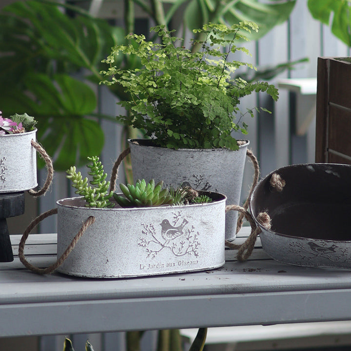 Decorative storage basket made of metal with natural design Stornfield