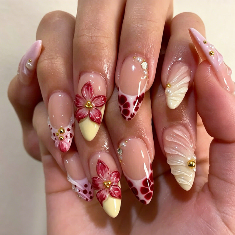 Art nail set with creative floral design and glittering accents Stornfield