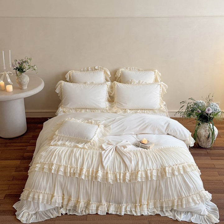 Romantic ruffled velvet bed set with pleated frills and decorative cushions