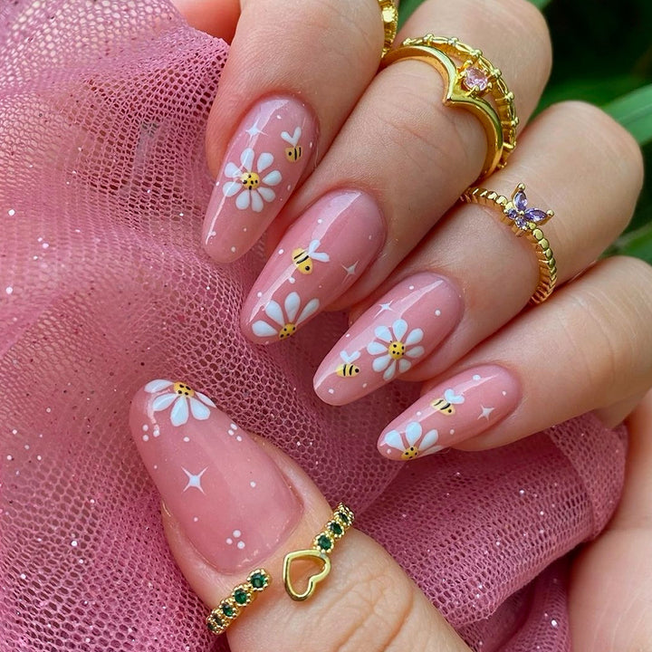 Artificial nails set with elegant flowers and glitter accents Stornfield