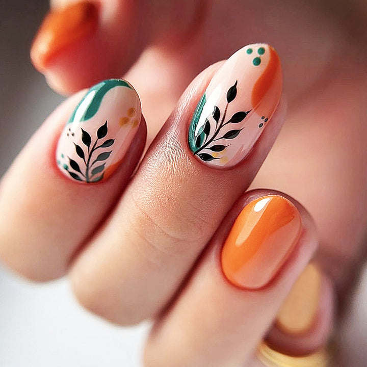 Artificial nail set with floral patterns and elegant glitter accents Stornfield