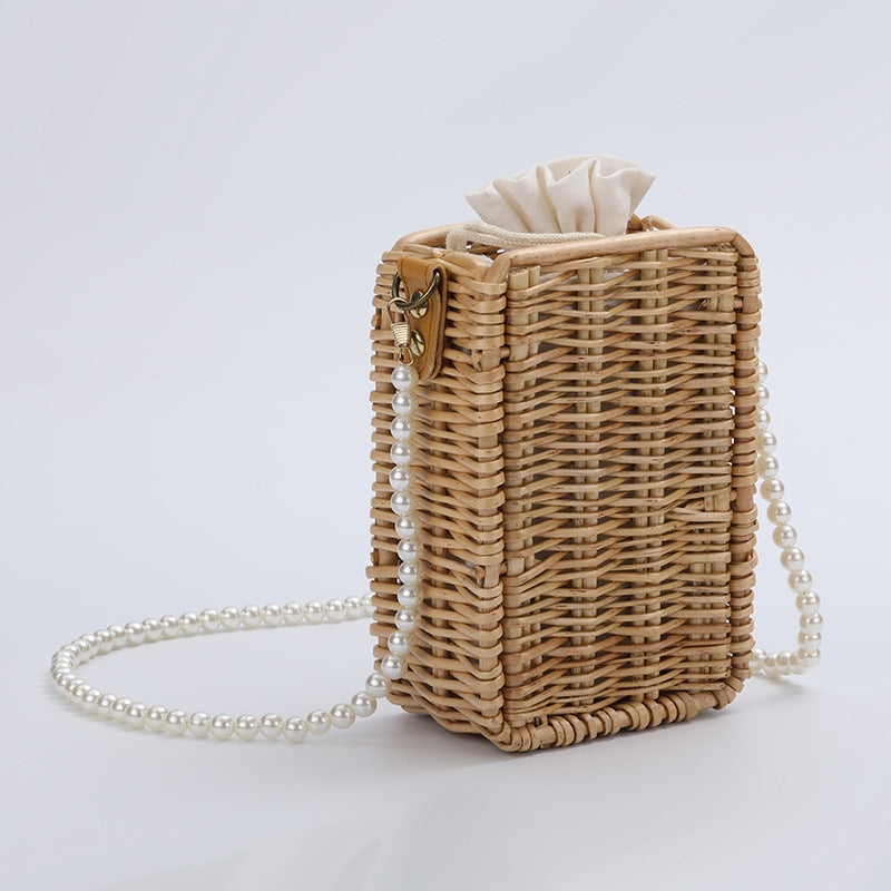 Women's handbag made of woven material with pearl accents Stornfield