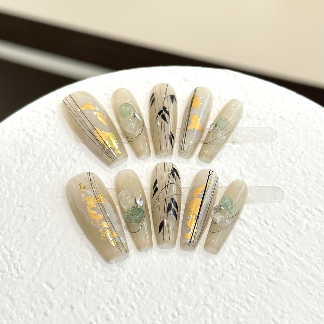 Decorative Press-On Nail Set with Artistic Accents