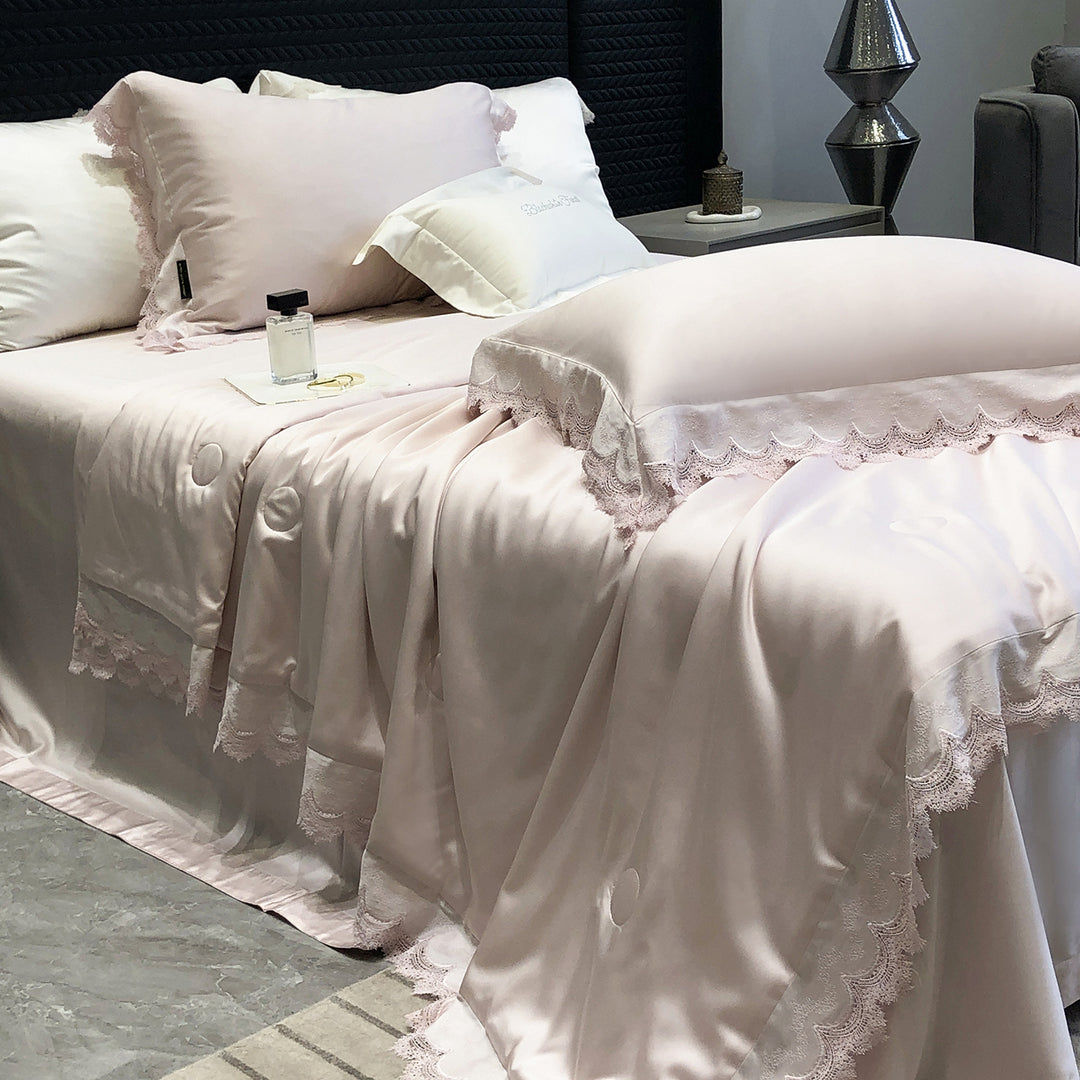 Elegant satin bedding set with lace trim and quilted bedspread