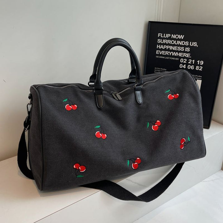 Sporty weekend bag with playful cherry pattern Stornfield