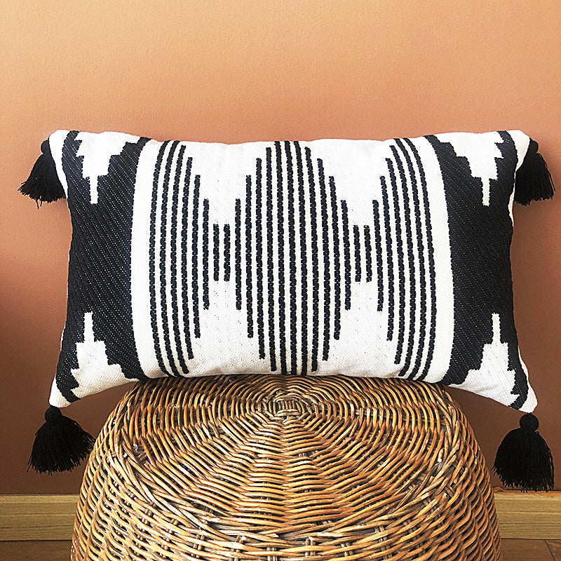 Rectangular woven cushion cover in ethnic jacquard with four tassels and concealed zipper