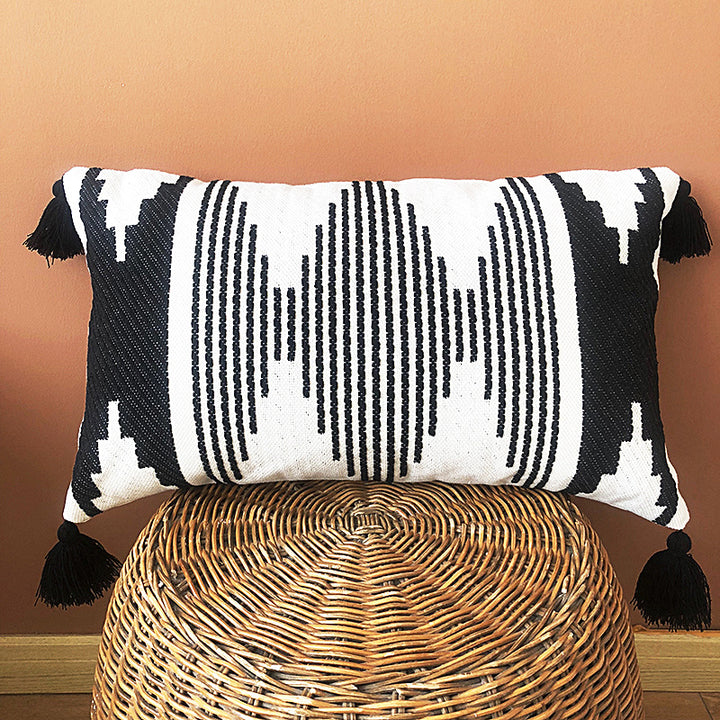 Rectangular woven cushion cover in ethnic jacquard with four tassels and concealed zipper