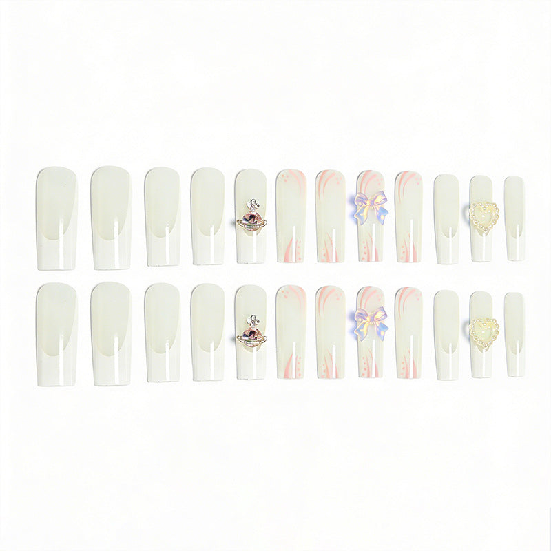 Artificial nails with delicate embellishments Stornfield