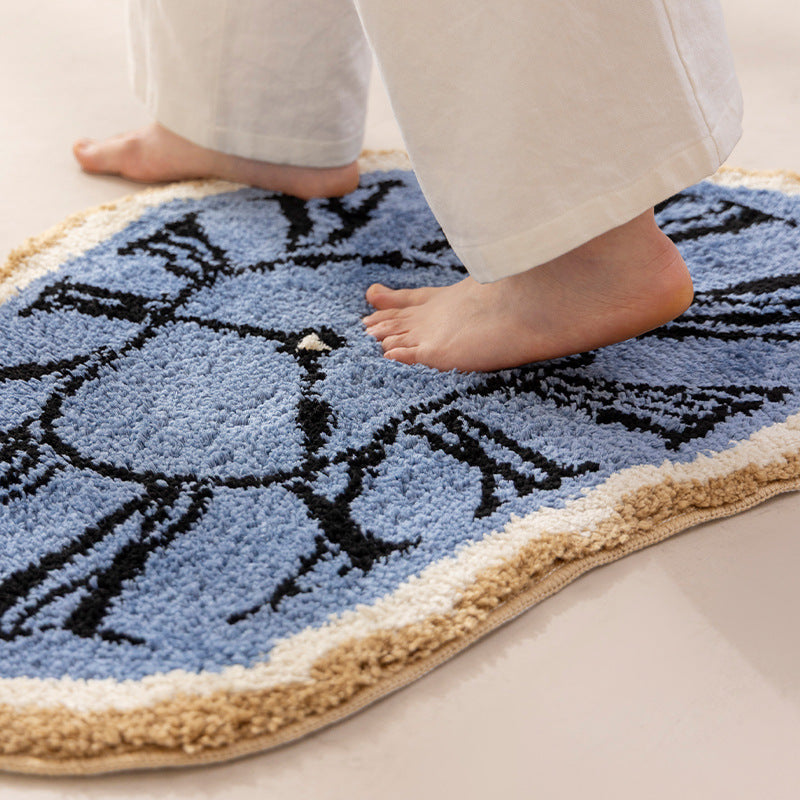 Decorative hand-tufted rug mat in organic clock shape Stornfield