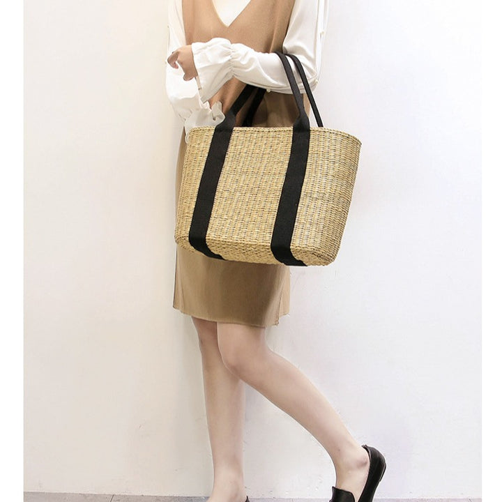 Spacious straw tote bag with comfortable, reinforced handles Stornfield