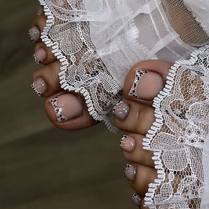 Artistic toenail design with elegant tips Stornfield