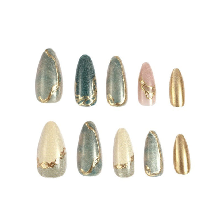 Artificial nails with elegant golden accents Stornfield