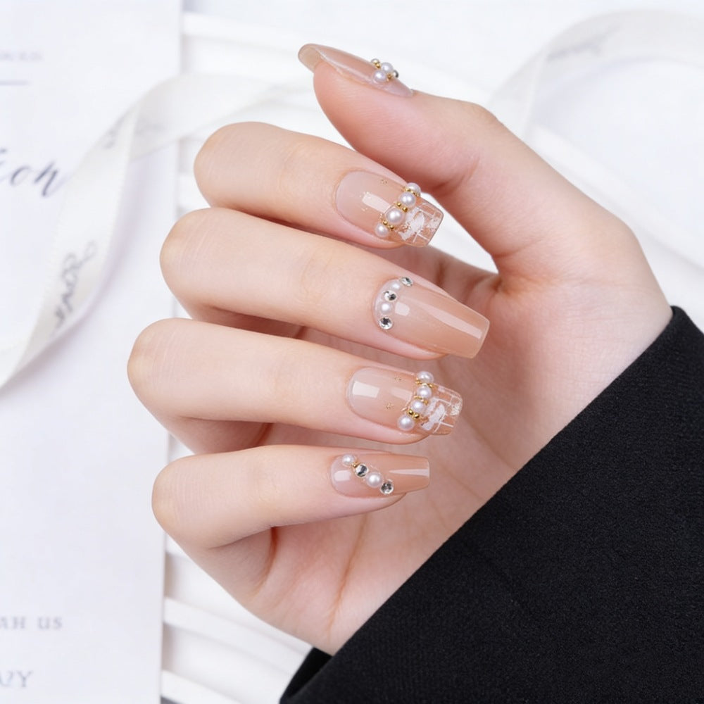 Artificial nails with elegant pearl and glitter decorations Stornfield