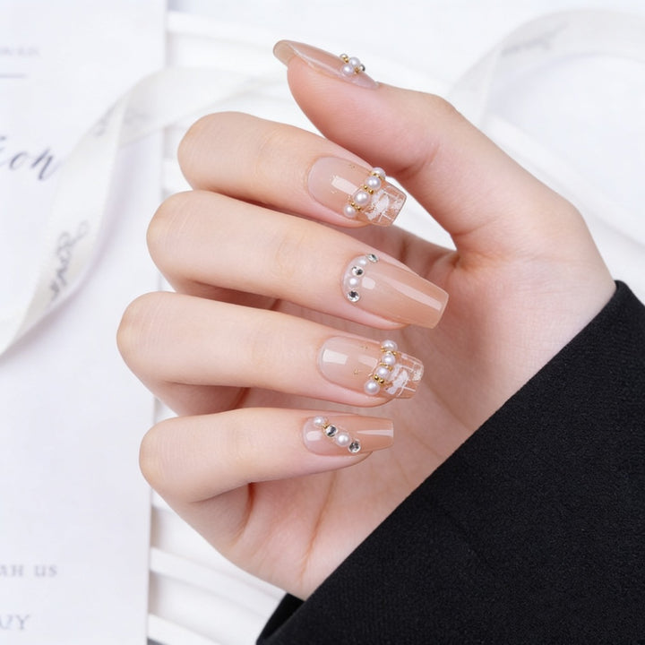 Artificial nails with elegant pearl and glitter decorations Stornfield