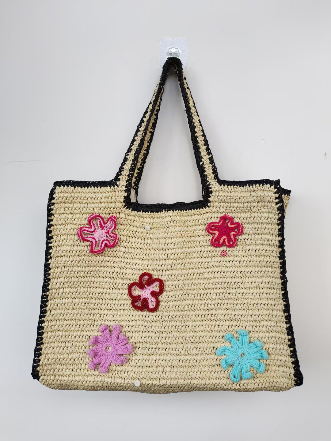 Handmade straw bag with flower appliqués Stornfield