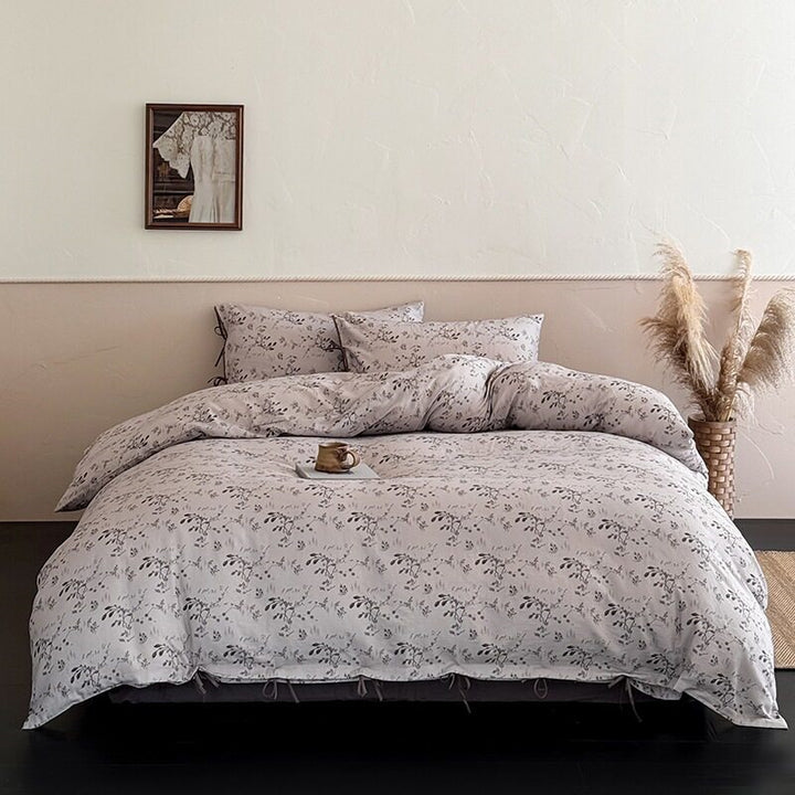 Finely woven cotton bedding set with delicate floral print and decorative ties