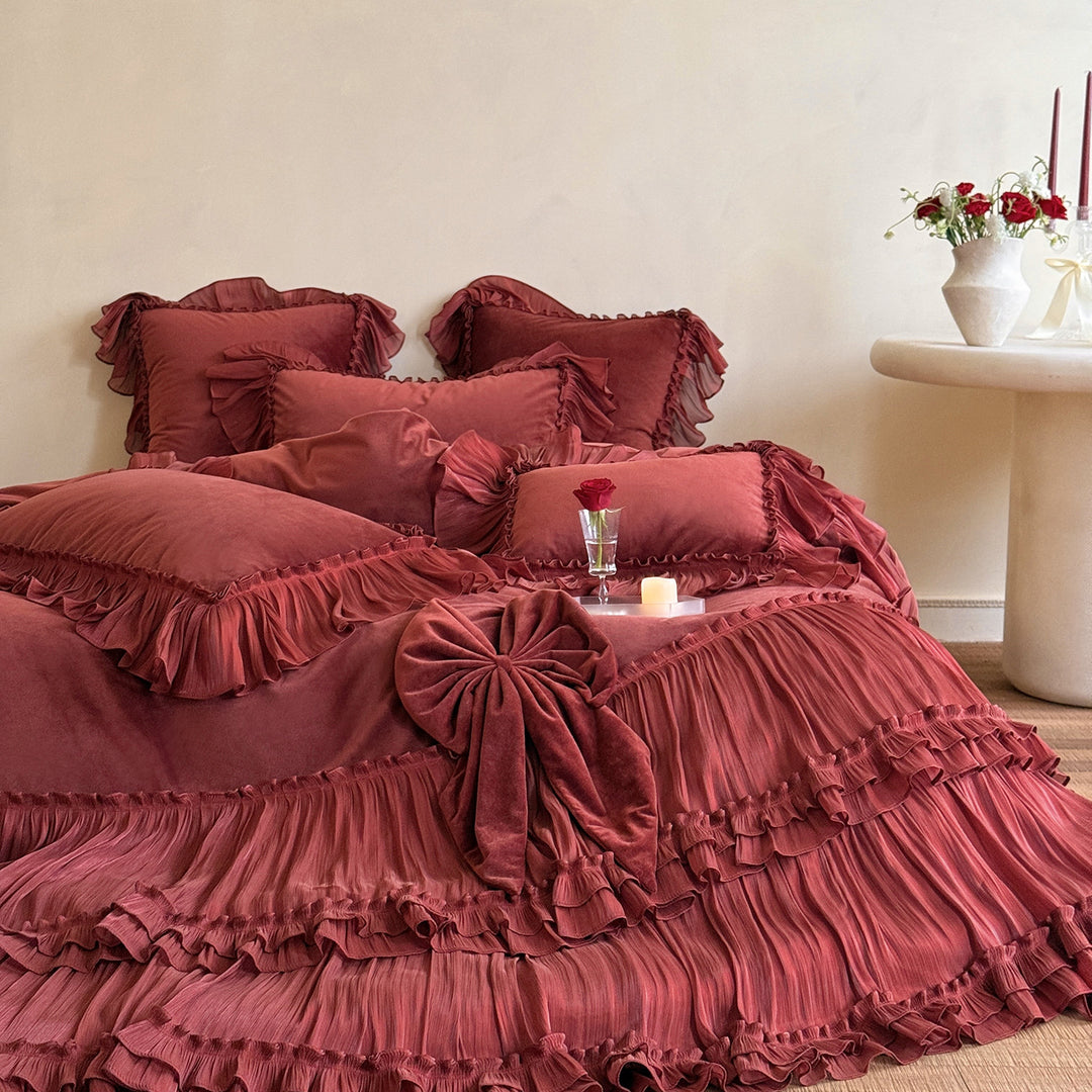 Romantic ruffled velvet bed set with pleated frills and decorative cushions