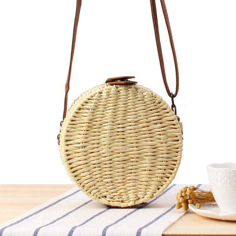 Round basket bag with leather accents Stornfield