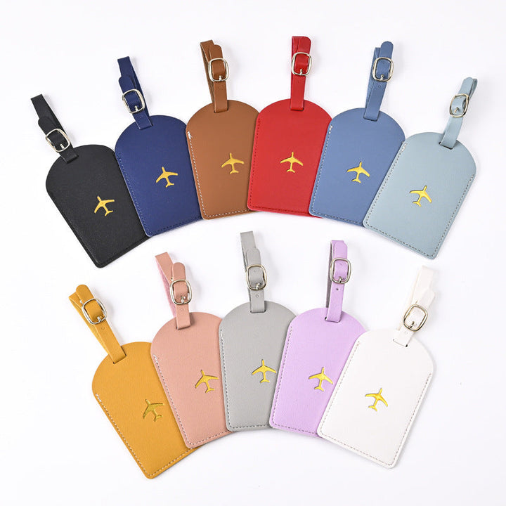 premium leather luggage tag with adjustable buckle strap and embossed airplane Stornfield