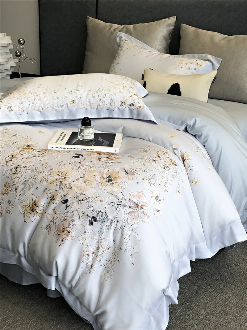 Duvet cover set made of cotton satin with subtle watercolor flower print and silky-matte texture