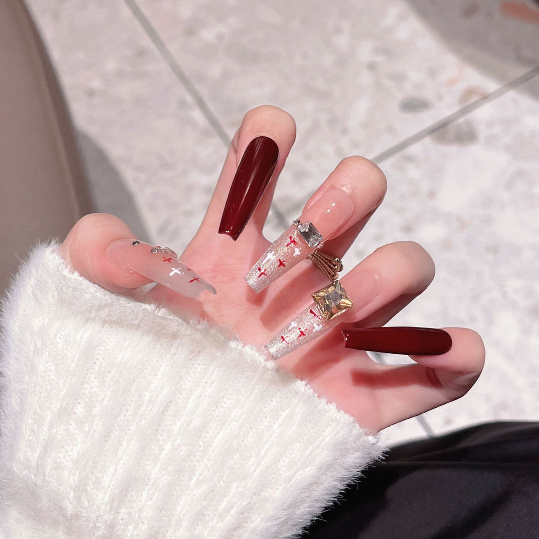 Artistic Stiletto Press-On Nail Art with Glimmering Accents Stornfield