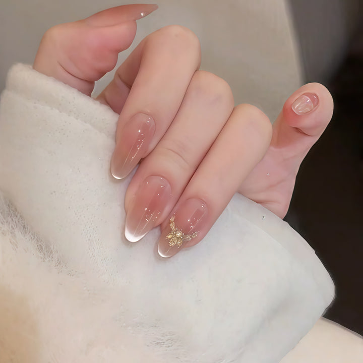 Artificial nails with elegant tip design and gold accents Stornfield