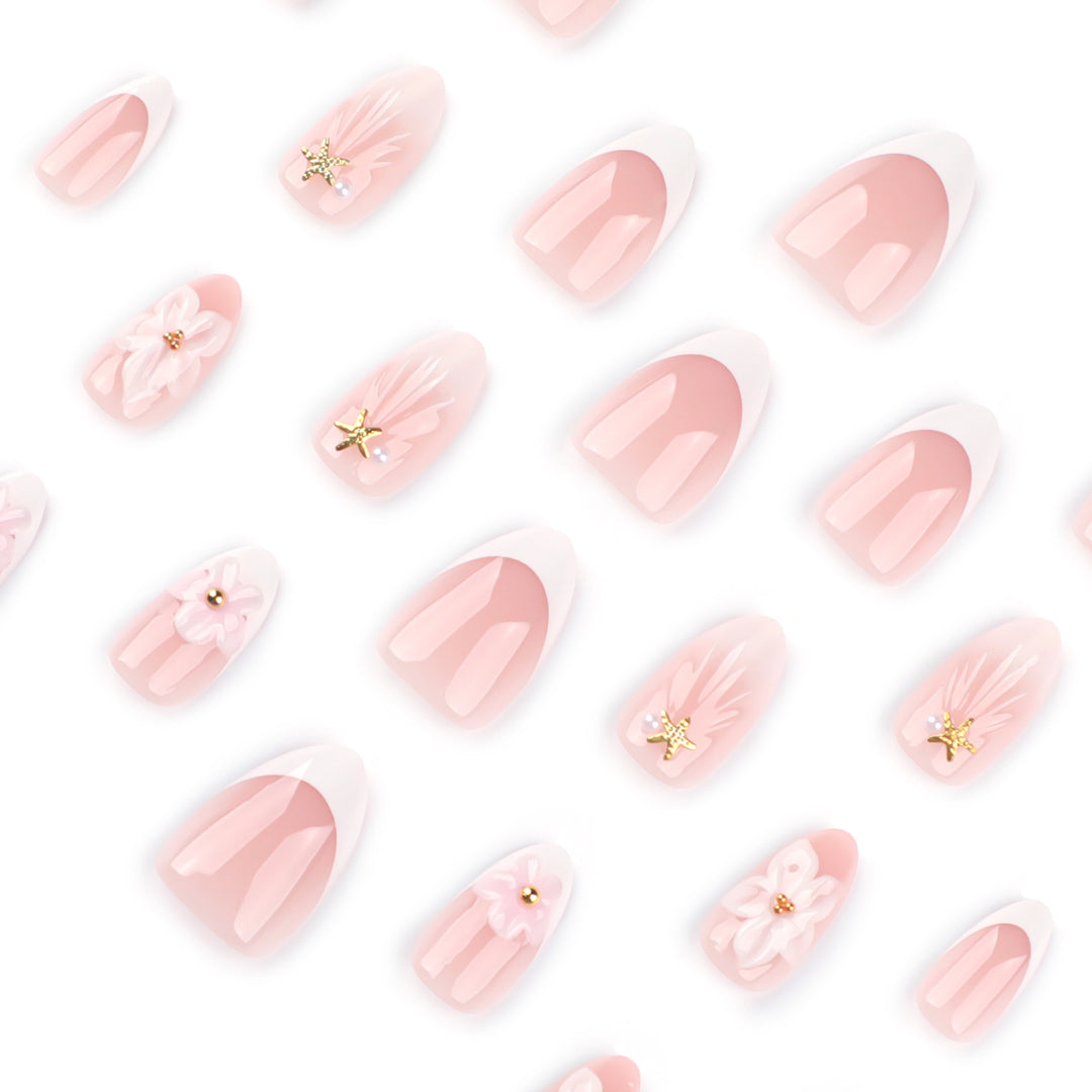 Elegant artificial nails with floral design and glitter accents Stornfield