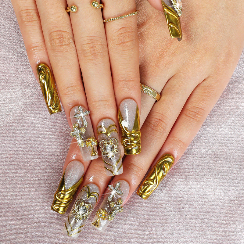 Artificial nail set with luxurious gold embellishments Stornfield