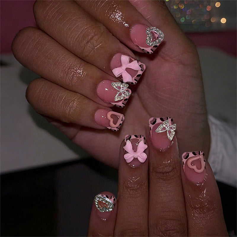 Decorative Press-On Nail Set with Artistic Bow and Heart Accents Stornfield