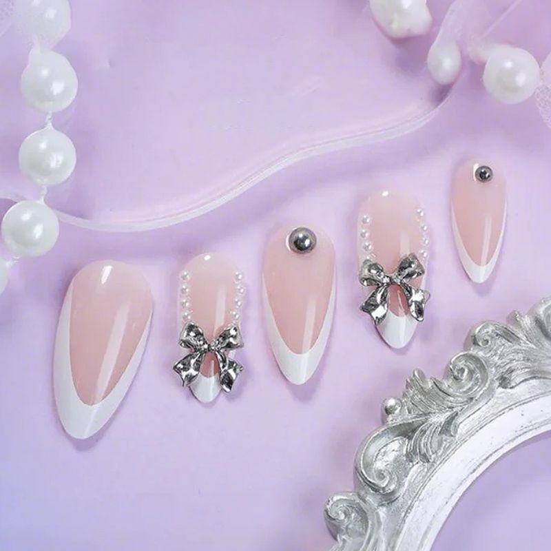 Artificial nail set with elegant French tips and decoration accents Stornfield