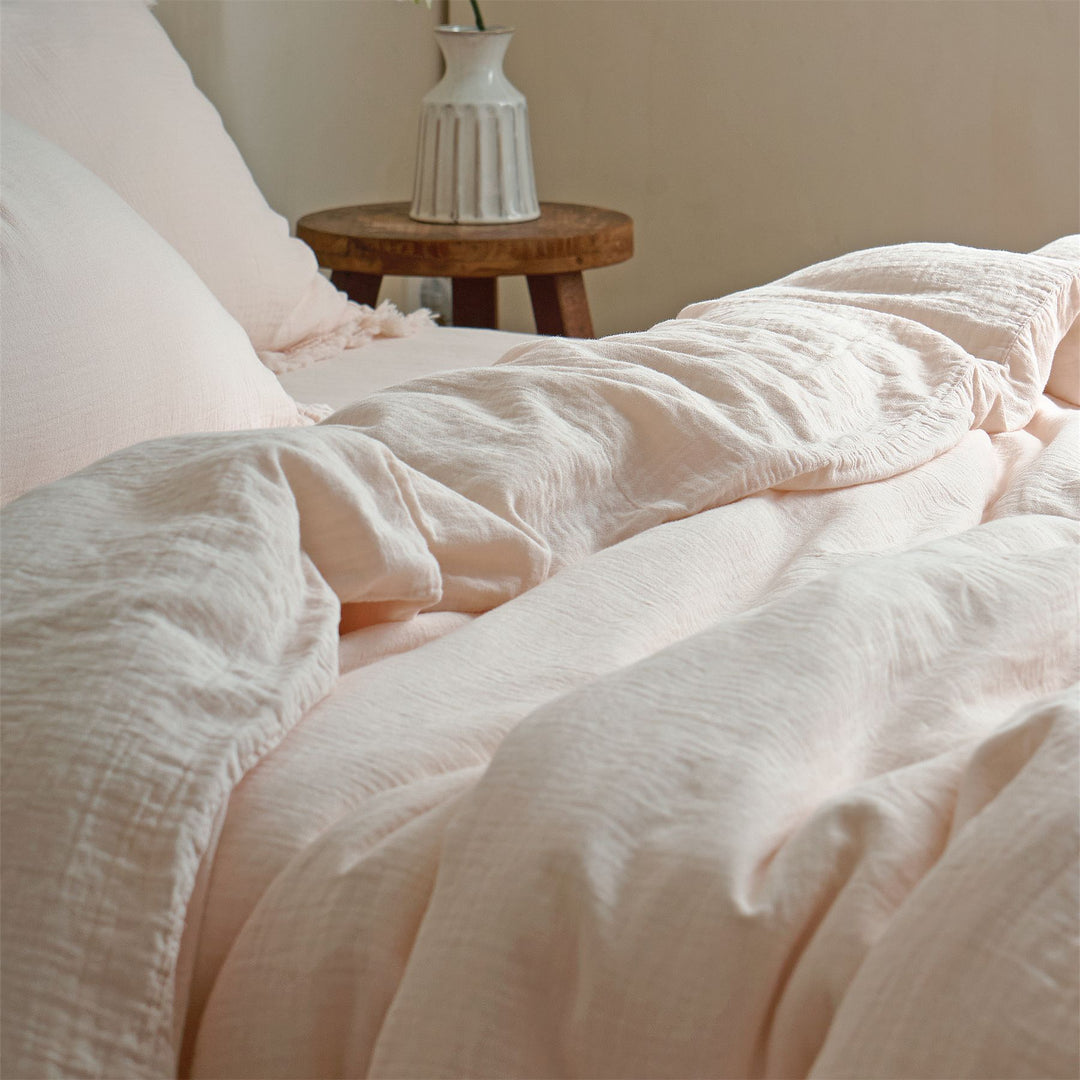 Washed linen bedding set with fringe trim and natural texture