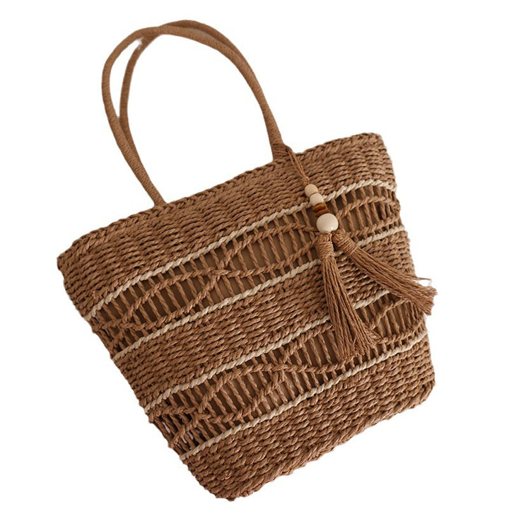 Handcrafted straw tote bag with decorative tassel detail Stornfield