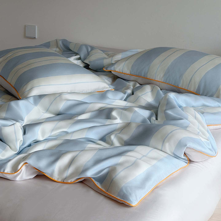 Luxurious cotton satin bedding set with fine striped pattern and piping
