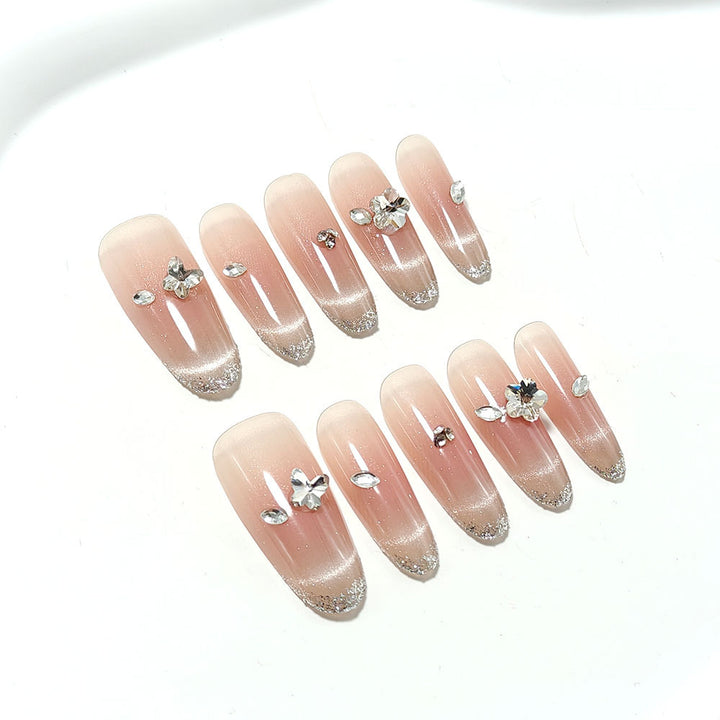 Glamorous artificial nails with glitter decorations Stornfield