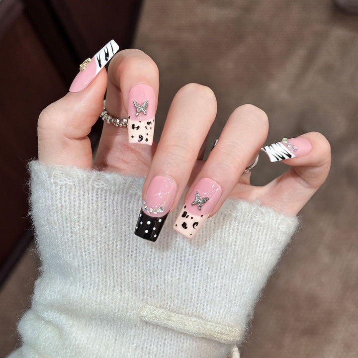 Artistic Press-On Nail Enhancements with Pattern and Gem Accents