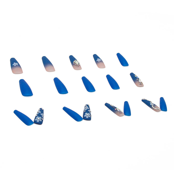 Nail art set with elegant 3D flower designs and glitter accents Stornfield