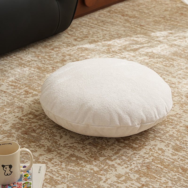 Round floor seat pouf made of teddy plush with a shape-retaining padded core Stornfield