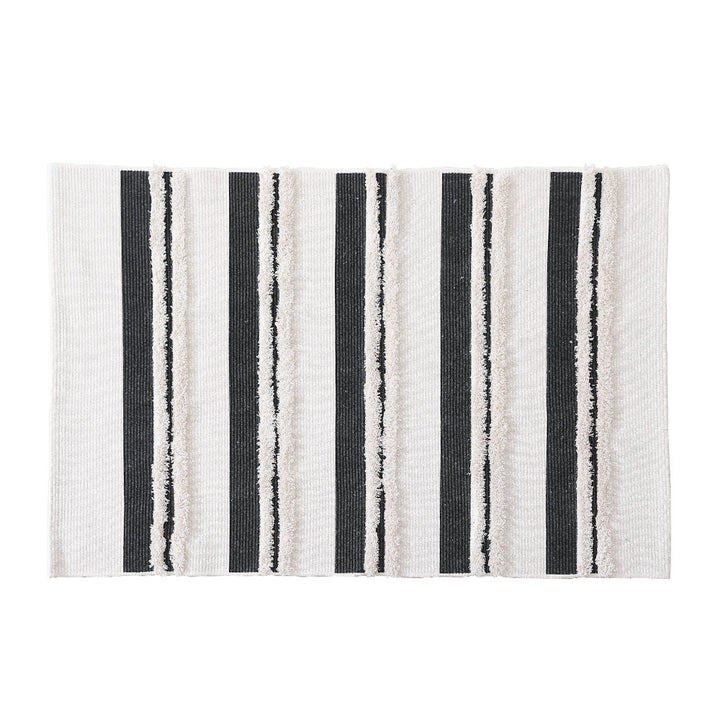 Cotton bath mat with textured stripes and fringes Stornfield